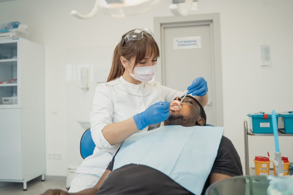 Dentist examining a patient during an emergency dental appointment in Atlanta, GA.